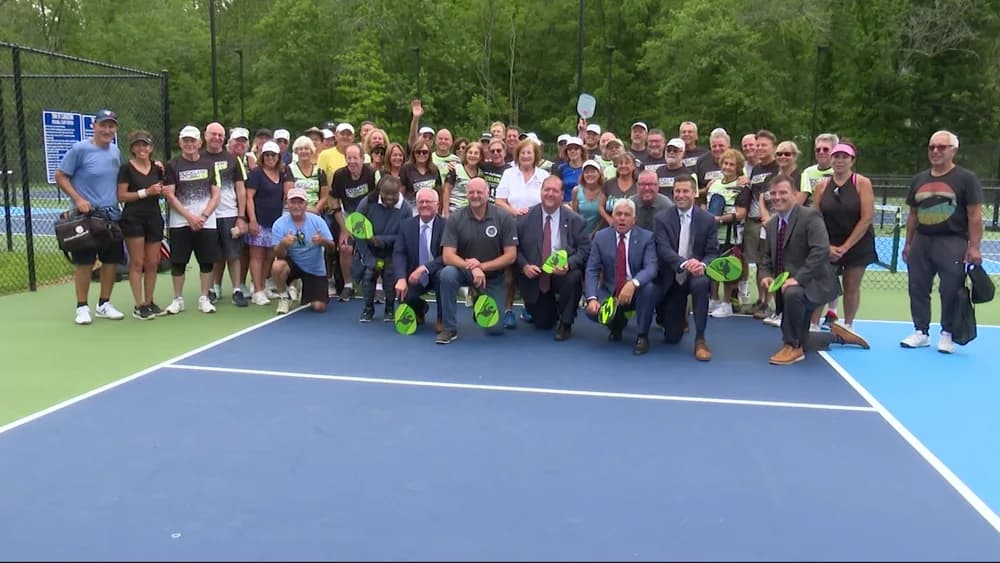 Community members gathered on the new pickleball courts at Congers Lake Memorial Park