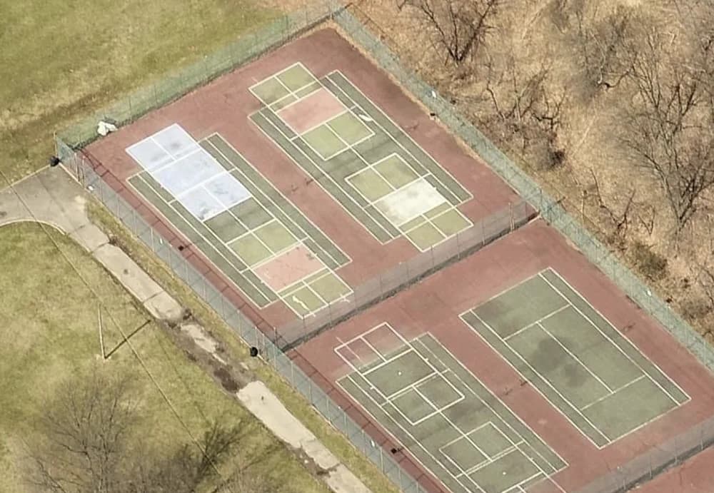Overhead view of the lined tennis courts at Rockland Lake State Park