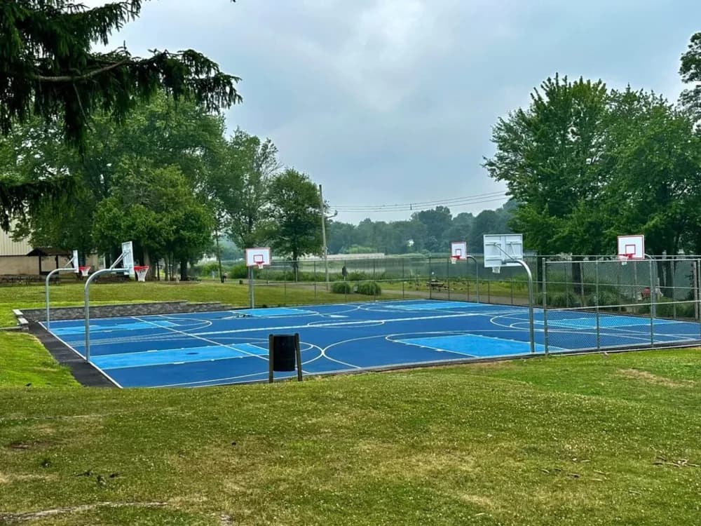 Renovated blue basketball courts at Congers Lake Memorial Park