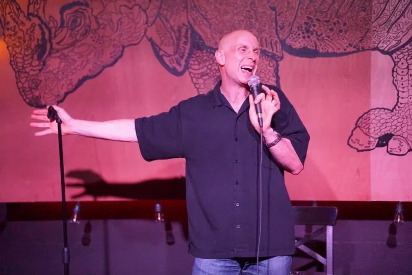 Comedian performing at Rhino Comedy
